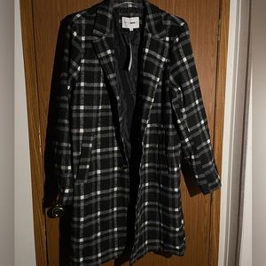 Plaid black & white overcoat.